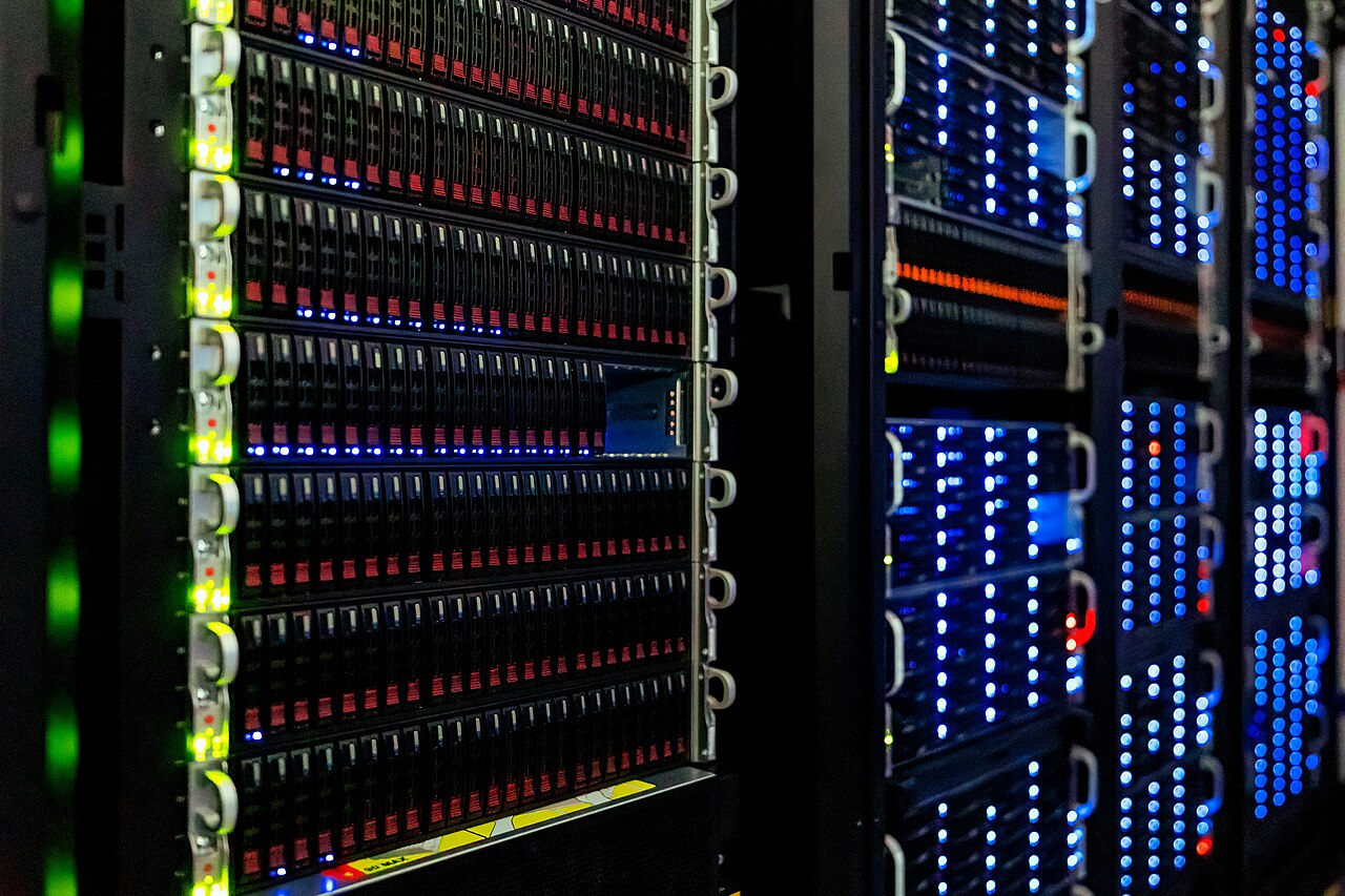 Server racks with status lights in a data hall
